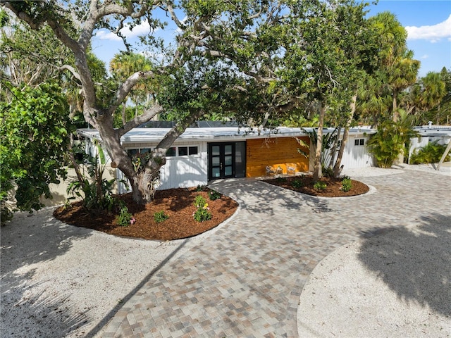4879 Commonwealth Dr, Sarasota, FL 34242 - mid-century home featuring french doors and curved driveway