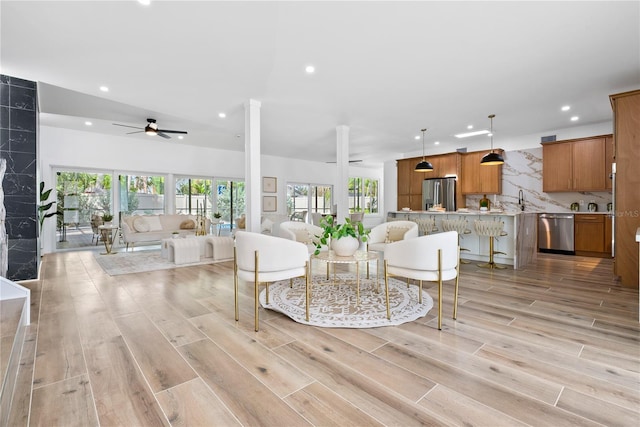 4879 Commonwealth Dr, Sarasota, FL 34242 - living area featuring recessed lighting, ceiling fan, plenty of natural light, and light wood finished floors