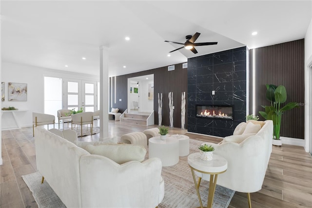 4879 Commonwealth Dr, Sarasota, FL 34242 - living area with a ceiling fan, wood finished floors, a fireplace, and recessed lighting