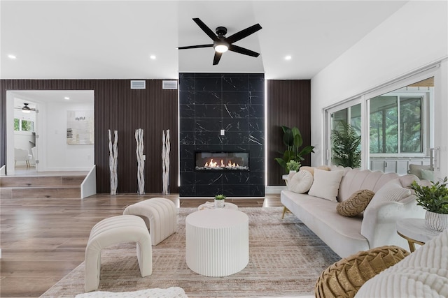 4879 Commonwealth Dr, Sarasota, FL 34242 - living area with ceiling fan, wood finished floors, recessed lighting, and a premium fireplace