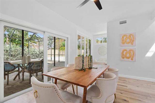 4879 Commonwealth Dr, Sarasota, FL 34242 - dining room featuring a ceiling fan and light wood-style floors