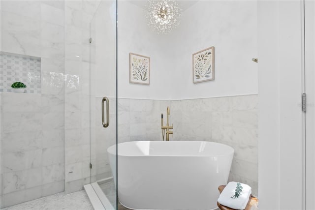 4879 Commonwealth Dr, Sarasota, FL 34242 - bathroom featuring a freestanding bath, a stall shower, and a chandelier