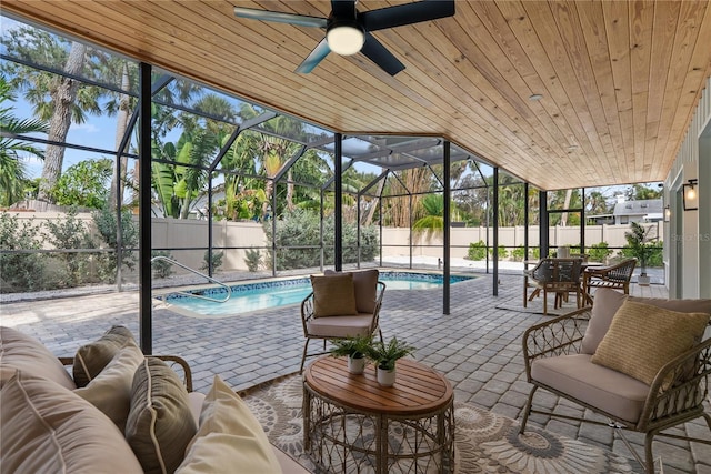 4879 Commonwealth Dr, Sarasota, FL 34242 - sunroom / solarium featuring a pool, ceiling fan, an outdoor hangout area, and vaulted ceiling