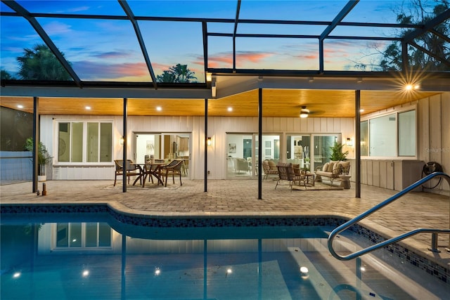 4879 Commonwealth Dr, Sarasota, FL 34242 - back of house with a patio, an outdoor hangout area, an outdoor pool, and a lanai