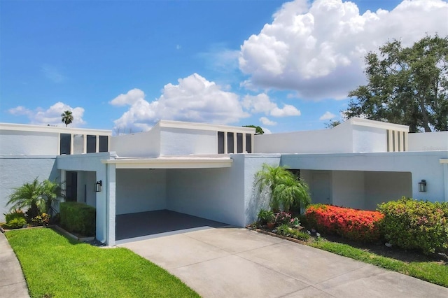 4116 61st Avenue Terrace W, Bradenton, FL 34210 - contemporary home featuring driveway, stucco siding, and a carport