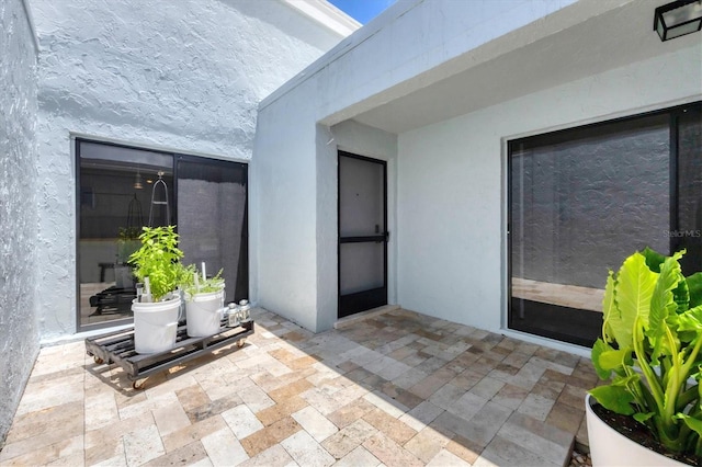 4116 61st Avenue Terrace W, Bradenton, FL 34210 - property entrance featuring stucco siding and a patio area