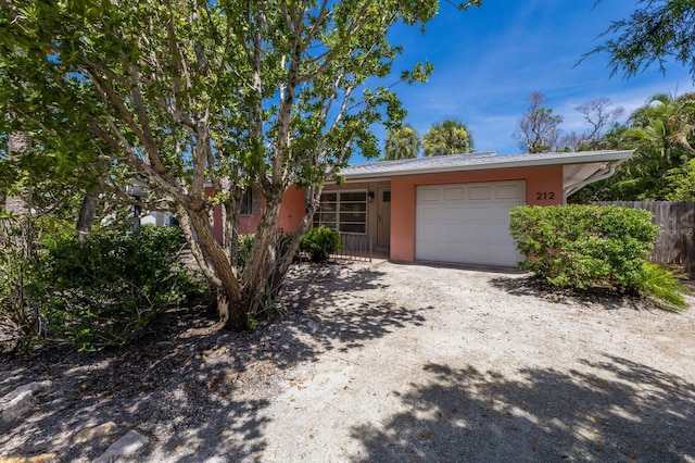 212 71st St, Holmes Beach, FL 34217 - single story home featuring an attached garage and dirt driveway