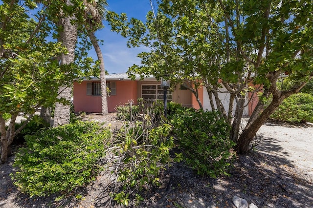 212 71st St, Holmes Beach, FL 34217 - view of front of property featuring stucco siding