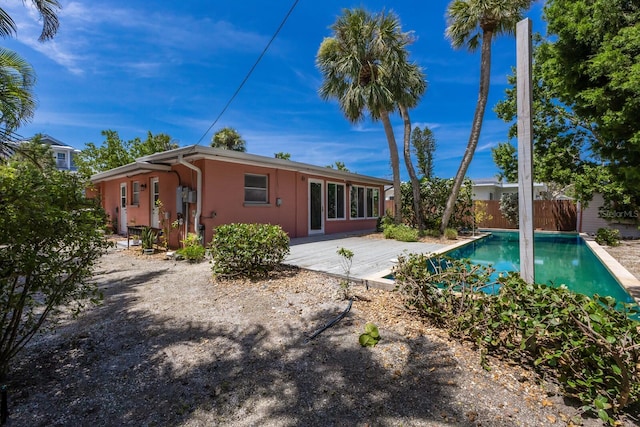 212 71st St, Holmes Beach, FL 34217 - back of house featuring stucco siding