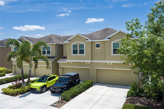 11562 84th Street Cir E Unit 103, Parrish, FL 34219 - traditional-style home featuring stucco siding, driveway, and an attached garage