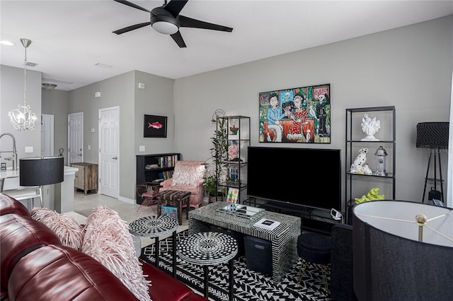 11562 84th Street Cir E Unit 103, Parrish, FL 34219 - living room featuring a chandelier and a ceiling fan