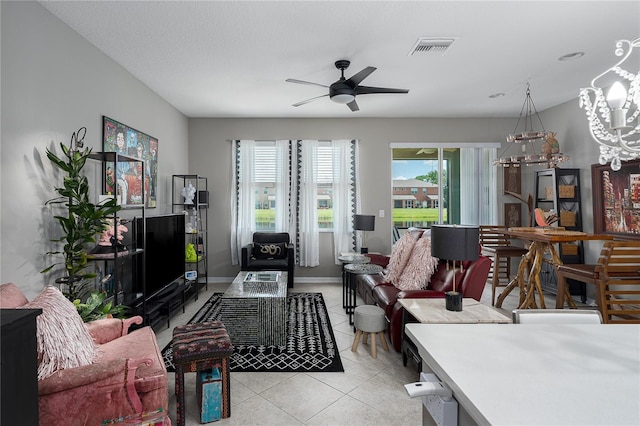 11562 84th Street Cir E Unit 103, Parrish, FL 34219 - living area with a chandelier, light tile patterned floors, and ceiling fan