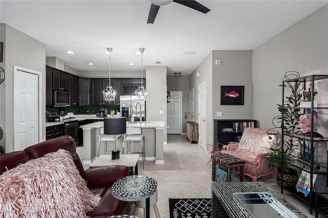 11562 84th Street Cir E Unit 103, Parrish, FL 34219 - living area featuring a chandelier, ceiling fan, light tile patterned floors, and recessed lighting