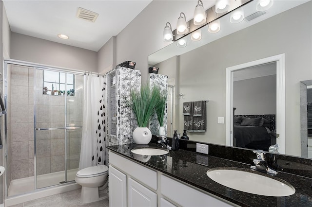 11562 84th Street Cir E Unit 103, Parrish, FL 34219 - ensuite bathroom featuring a shower stall, double vanity, and tile patterned floors