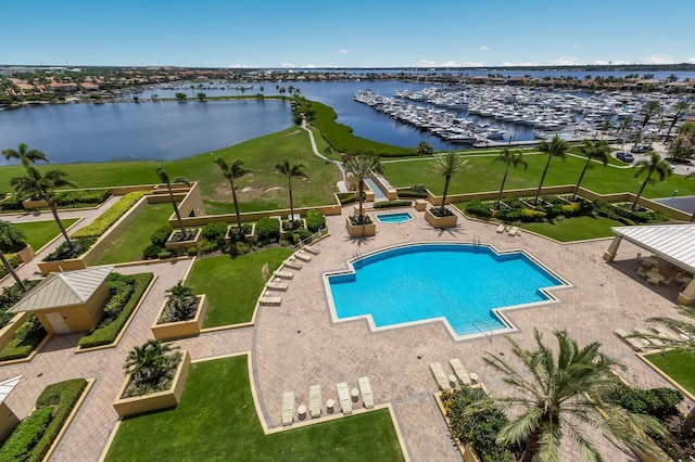130 Riviera Dunes Way Unit 601, Palmetto, FL 34221 - community pool with a water view, a patio, and a hot tub
