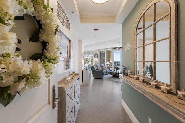 130 Riviera Dunes Way Unit 601, Palmetto, FL 34221 - hall with a raised ceiling, light tile patterned flooring, and ornamental molding