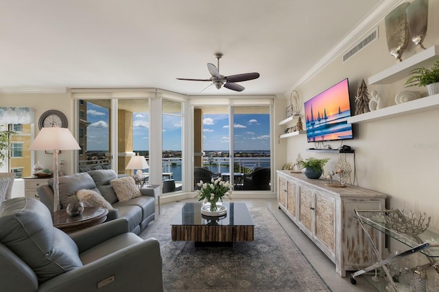 130 Riviera Dunes Way Unit 601, Palmetto, FL 34221 - living area with ceiling fan, crown molding, and plenty of natural light