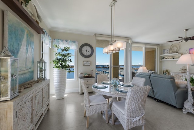 130 Riviera Dunes Way Unit 601, Palmetto, FL 34221 - dining space with a chandelier, ceiling fan, crown molding, and tile patterned flooring