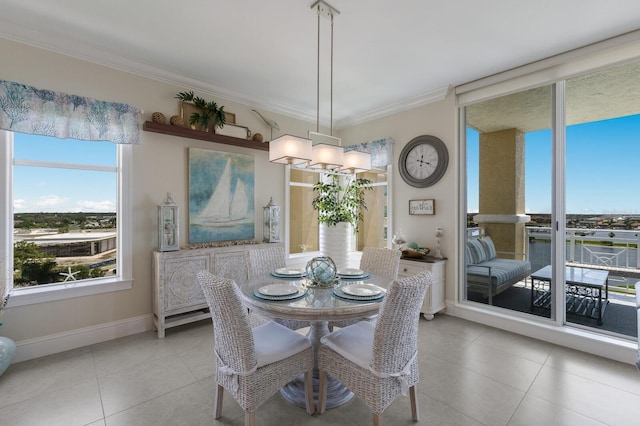 130 Riviera Dunes Way Unit 601, Palmetto, FL 34221 - dining room featuring crown molding and light tile patterned flooring