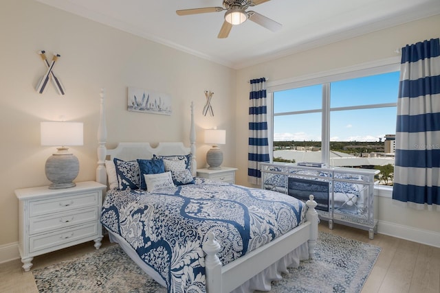130 Riviera Dunes Way Unit 601, Palmetto, FL 34221 - bedroom featuring ornamental molding, wood finished floors, and ceiling fan