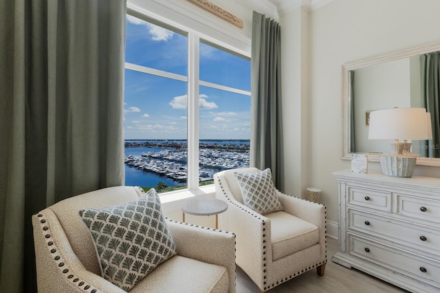 130 Riviera Dunes Way Unit 601, Palmetto, FL 34221 - sitting room featuring a water view, view of marina, and light wood-style floors