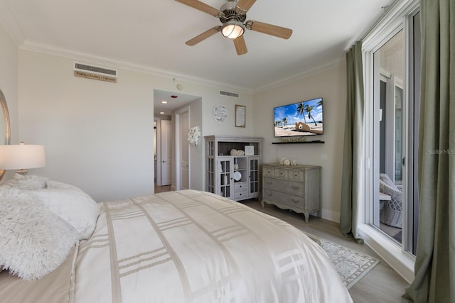 130 Riviera Dunes Way Unit 601, Palmetto, FL 34221 - bedroom with ornamental molding, light wood-style floors, and ceiling fan