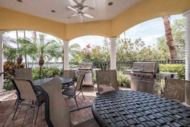 130 Riviera Dunes Way Unit 601, Palmetto, FL 34221 - view of patio / terrace with outdoor dining space, a ceiling fan, and an outdoor kitchen
