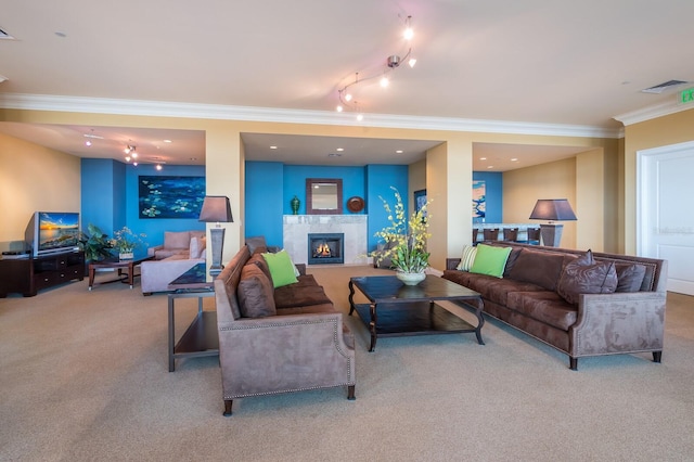 130 Riviera Dunes Way Unit 601, Palmetto, FL 34221 - living room featuring carpet flooring, crown molding, track lighting, and a glass covered fireplace