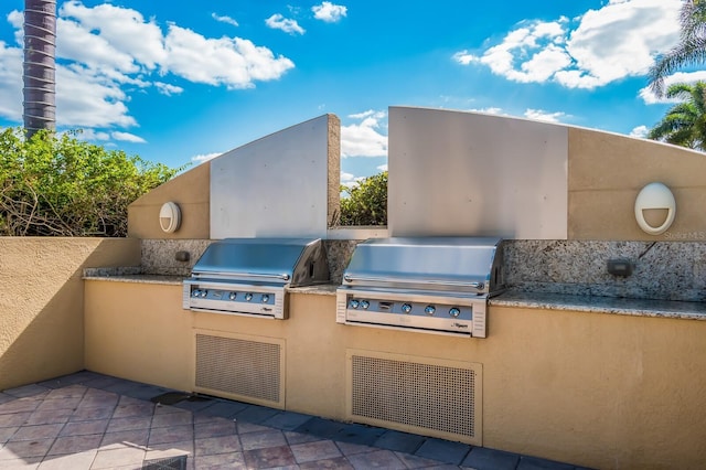 130 Riviera Dunes Way Unit 601, Palmetto, FL 34221 - view of patio featuring exterior kitchen