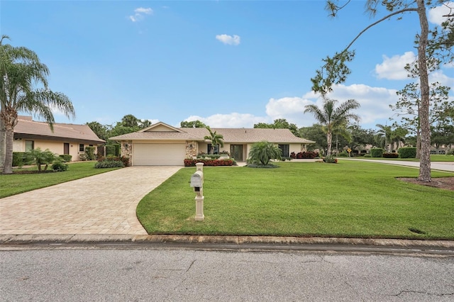 5283 Everwood Run, Sarasota, FL 34235 - single story home featuring decorative driveway, an attached garage, and a front lawn