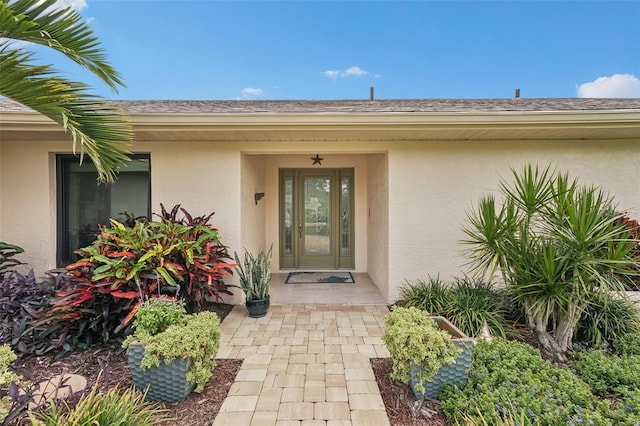 5283 Everwood Run, Sarasota, FL 34235 - view of exterior entry with stucco siding