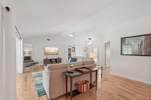 5283 Everwood Run, Sarasota, FL 34235 - living area with vaulted ceiling, light wood finished floors, and a ceiling fan