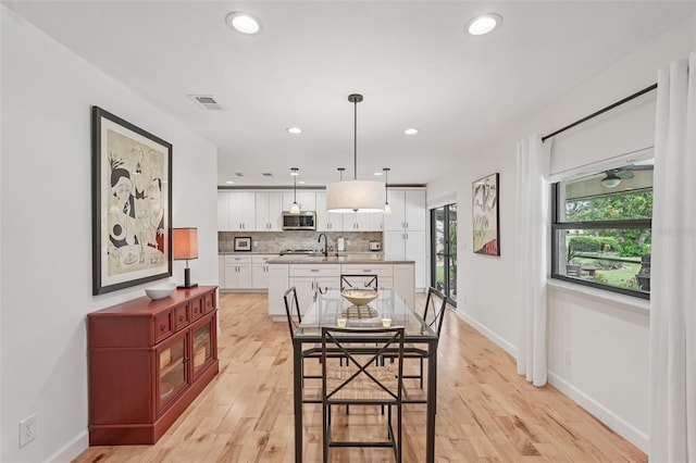5283 Everwood Run, Sarasota, FL 34235 - dining area featuring light wood finished floors and recessed lighting