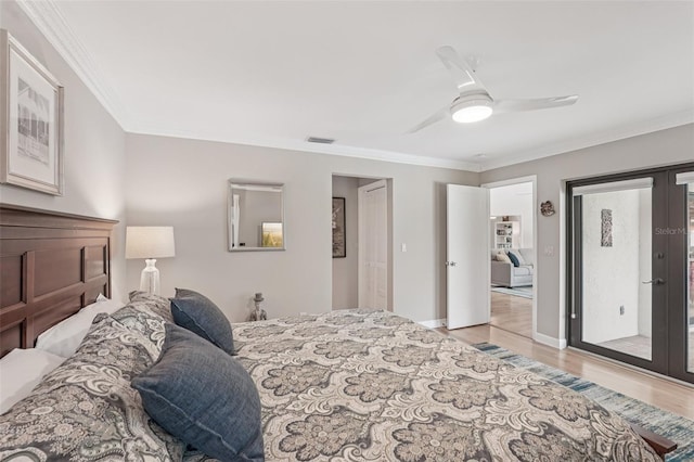 5283 Everwood Run, Sarasota, FL 34235 - bedroom featuring light wood-style floors, ornamental molding, french doors, and a ceiling fan