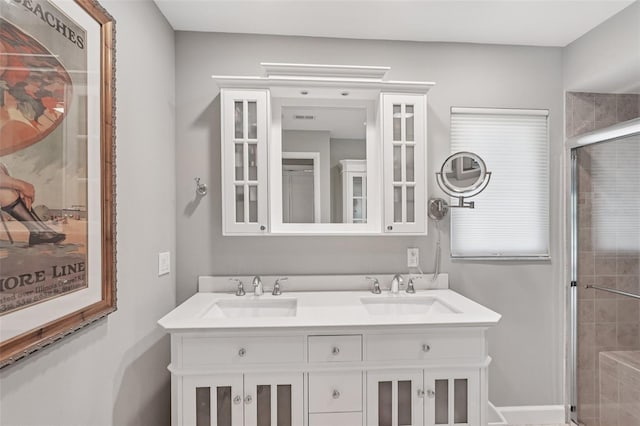5283 Everwood Run, Sarasota, FL 34235 - bathroom featuring a stall shower and double vanity