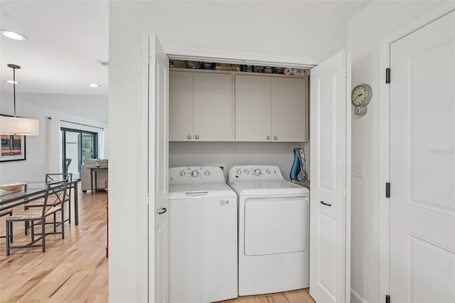 5283 Everwood Run, Sarasota, FL 34235 - laundry area featuring cabinet space, washer and dryer, light wood-type flooring, and recessed lighting