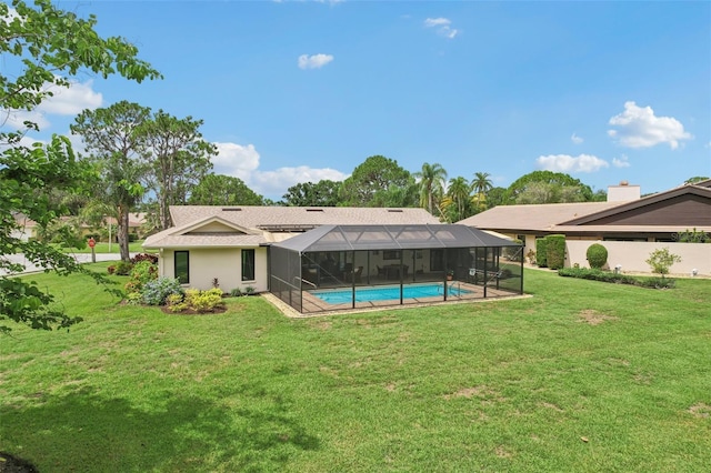 5283 Everwood Run, Sarasota, FL 34235 - rear view of house featuring a lawn, an outdoor pool, a lanai, and stucco siding