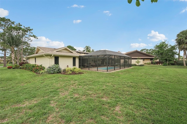 5283 Everwood Run, Sarasota, FL 34235 - back of property featuring a yard, stucco siding, an outdoor pool, and a lanai