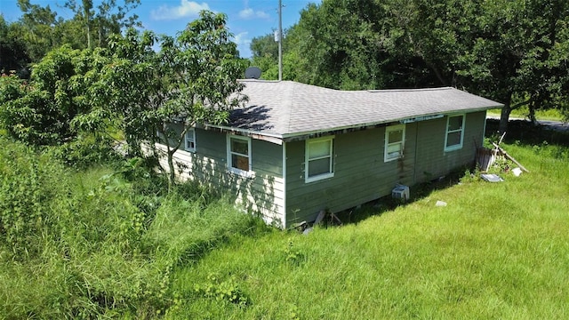 7700 SW Hull Ave, Arcadia, FL 34269 - view of side of home featuring roof with shingles