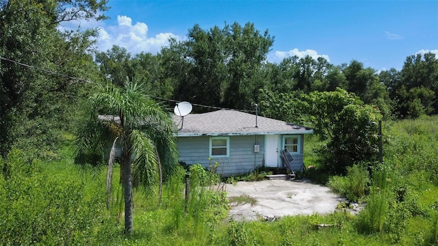 7700 SW Hull Ave, Arcadia, FL 34269 - back of property featuring a patio and a wooded view