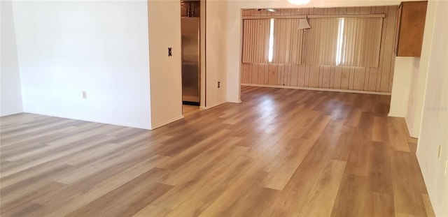 4640 Orlando Cir, Bradenton, FL 34207 - spare room with light wood-type flooring and baseboards