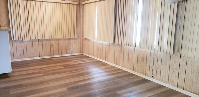 4640 Orlando Cir, Bradenton, FL 34207 - empty room featuring wood finished floors and wooden walls