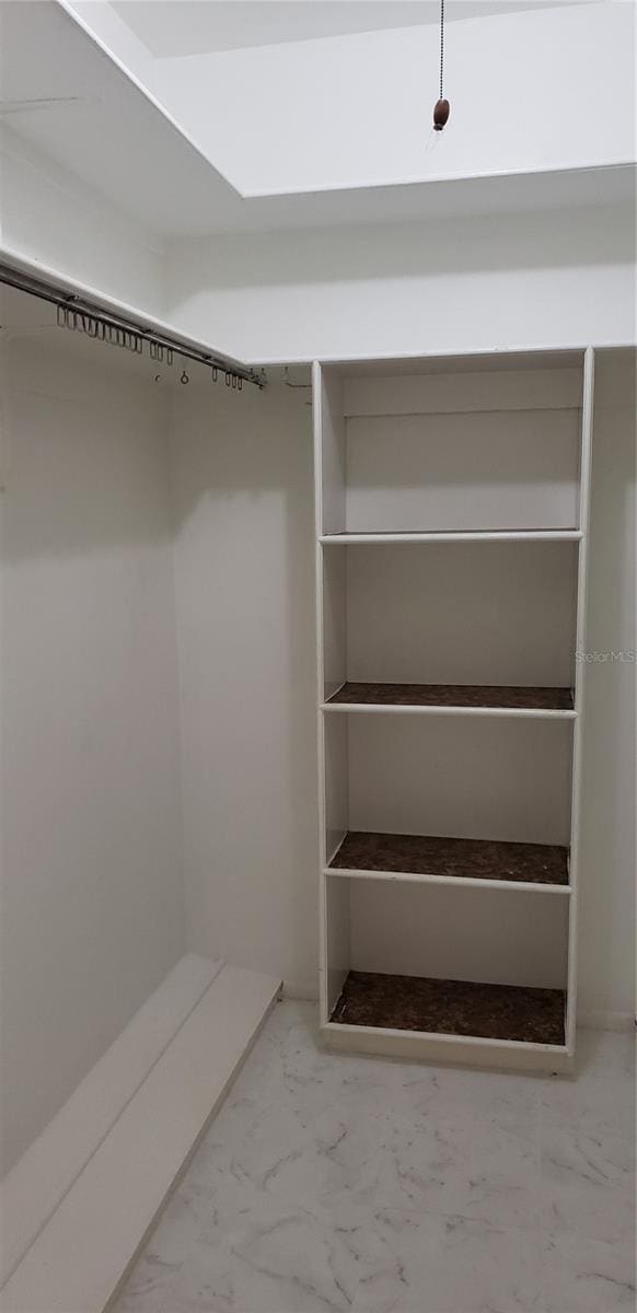 4640 Orlando Cir, Bradenton, FL 34207 - walk in closet featuring marble finish floors