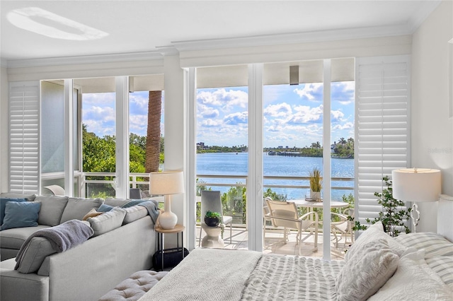 225 Sands Point Rd Unit 6103, Longboat Key, FL 34228 - bedroom featuring a water view, ornamental molding, multiple windows, and access to exterior
