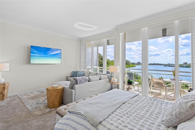 225 Sands Point Rd Unit 6103, Longboat Key, FL 34228 - carpeted bedroom with a water view, access to exterior, and crown molding