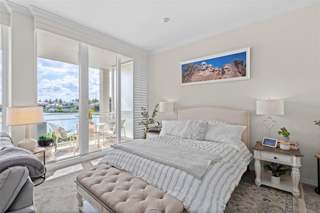225 Sands Point Rd Unit 6103, Longboat Key, FL 34228 - bedroom featuring crown molding, a water view, and access to outside