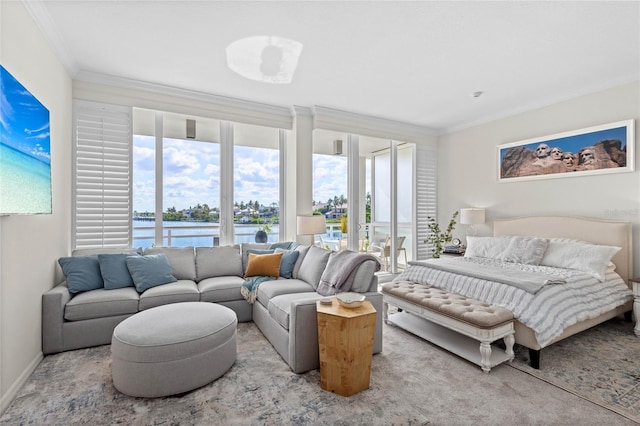 225 Sands Point Rd Unit 6103, Longboat Key, FL 34228 - bedroom featuring ornamental molding, a water view, and multiple windows