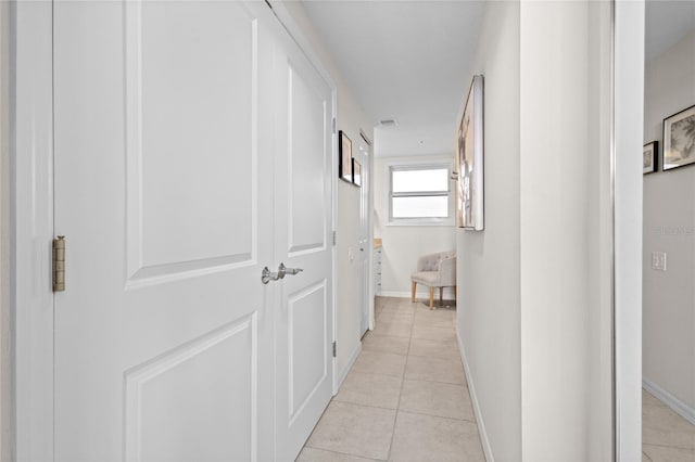 225 Sands Point Rd Unit 6103, Longboat Key, FL 34228 - corridor featuring light tile patterned floors and baseboards