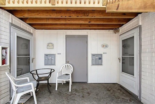 1036 W Peppertree Ln Unit 113B, Sarasota, FL 34242 - view of patio / terrace featuring electric panel