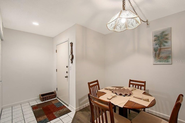 1036 W Peppertree Ln Unit 113B, Sarasota, FL 34242 - tiled dining area with baseboards
